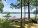 Lakeside backyard with a deck, seating, hammock, and lake view at 901 Edgewater Dr, Garner, NC 27529