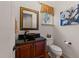 A stylish powder room featuring a unique vessel sink, custom vanity, and elegant fixtures at 901 Edgewater Dr, Garner, NC 27529