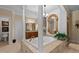 Elegant bathroom featuring a soaking tub with decorative columns and detailed woodwork throughout at 901 Edgewater Dr, Garner, NC 27529