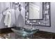 Contemporary bathroom vanity with a vessel sink and a decorative mirror at 901 Edgewater Dr, Garner, NC 27529