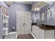 Stylish bathroom featuring a vessel sink, granite countertop, and white cabinets at 901 Edgewater Dr, Garner, NC 27529