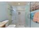 Updated bathroom features a frameless glass shower and designer touches, ideal for relaxation at 901 Edgewater Dr, Garner, NC 27529