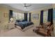 Bedroom featuring a ceiling fan, natural light from windows, and furnishings at 901 Edgewater Dr, Garner, NC 27529