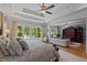 Spacious bedroom featuring a ceiling fan, recessed lighting, and sitting area with outside views at 901 Edgewater Dr, Garner, NC 27529