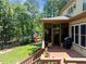 Exterior of home has a wood deck with a grill and an American flag at 901 Edgewater Dr, Garner, NC 27529