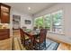 The dining room offers scenic views through large windows, creating a serene dining experience at 901 Edgewater Dr, Garner, NC 27529