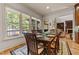 A dining room with large windows offering views, and hardwood floors adds a touch of elegance at 901 Edgewater Dr, Garner, NC 27529