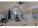 Spacious exercise room featuring home gym equipment, ample lighting, and neutral carpeting at 901 Edgewater Dr, Garner, NC 27529
