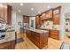 Open concept kitchen with custom wood cabinets, granite countertops, and modern appliances at 901 Edgewater Dr, Garner, NC 27529