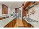 A chef's kitchen boasts granite counters, stainless appliances, gas cooktop, and ample storage space at 901 Edgewater Dr, Garner, NC 27529