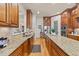 The kitchen is equipped with stainless steel appliances, granite counters, and custom wood cabinetry at 901 Edgewater Dr, Garner, NC 27529