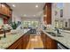 A kitchen features custom cabinets and granite countertops, offering a blend of style and functionality at 901 Edgewater Dr, Garner, NC 27529