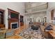 Cozy living room with a fireplace, built-in bookshelves, and a view of the upper level at 901 Edgewater Dr, Garner, NC 27529