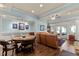 Open-plan living room features hardwood floors, a ceiling fan, and access to an outdoor patio at 901 Edgewater Dr, Garner, NC 27529