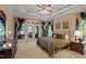 Elegant main bedroom featuring a decorative ceiling, a large bed, and access to an outdoor deck at 901 Edgewater Dr, Garner, NC 27529