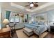 Bright and airy main bedroom with large windows, lake view, designer furnishings, and a king-size bed at 901 Edgewater Dr, Garner, NC 27529
