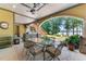 Inviting outdoor patio with dining table and a serene lake view, perfect for entertaining at 901 Edgewater Dr, Garner, NC 27529