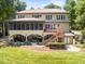 Expansive home with a screened porch, deck, manicured lawn and lake access at 901 Edgewater Dr, Garner, NC 27529