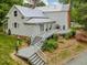 Backyard with a deck, landscaping, gray stairs and a well-manicured lawn at 967 Bynum Rd, Pittsboro, NC 27312