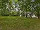 Large backyard with mature trees and open green spaces for outdoor activities at 967 Bynum Rd, Pittsboro, NC 27312