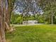 Picturesque backyard featuring a tree swing with a view of a nearby store at 967 Bynum Rd, Pittsboro, NC 27312