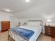 Bright bedroom with a sloped ceiling, a metal bed frame, hardwood floors, and neutral paint at 967 Bynum Rd, Pittsboro, NC 27312