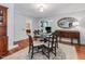 Dining room with decorative rug, fireplace, and natural light at 967 Bynum Rd, Pittsboro, NC 27312