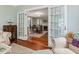 Elegant dining room with hardwood floors, decorative doors, and natural light at 967 Bynum Rd, Pittsboro, NC 27312
