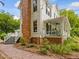 Charming home featuring a brick chimney, covered porch, and brick foundation at 967 Bynum Rd, Pittsboro, NC 27312