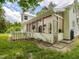 Charming white house with a screened porch and fenced yard, ideal for outdoor entertaining and relaxation at 967 Bynum Rd, Pittsboro, NC 27312