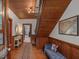 Inviting foyer with wooden walls, hardwood floors, and vintage-inspired decor at 967 Bynum Rd, Pittsboro, NC 27312