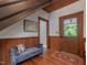 Warm foyer features wood trim, hardwood floors, and cozy seating at 967 Bynum Rd, Pittsboro, NC 27312
