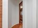 Hallway with wood paneled walls providing access to staircase at 967 Bynum Rd, Pittsboro, NC 27312