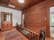 Hallway with hardwood floors and wood paneled walls at 967 Bynum Rd, Pittsboro, NC 27312