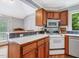 Kitchen with wood cabinets and modern appliances at 967 Bynum Rd, Pittsboro, NC 27312