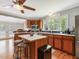 Kitchen with wood cabinets, stainless steel appliances, and center island with bar seating at 967 Bynum Rd, Pittsboro, NC 27312