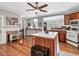 Spacious kitchen featuring wood cabinets, stainless steel appliances, and a center island at 967 Bynum Rd, Pittsboro, NC 27312