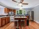 Kitchen featuring stainless steel appliances, a center island, and hardwood floors at 967 Bynum Rd, Pittsboro, NC 27312