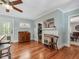 Sitting area with a decorative fireplace and beautiful wood floors at 967 Bynum Rd, Pittsboro, NC 27312