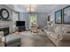 Comfortable living room with fireplace, casual seating, and natural light at 967 Bynum Rd, Pittsboro, NC 27312