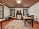 Office space with hardwood floors, two desks, fireplace and natural light at 967 Bynum Rd, Pittsboro, NC 27312