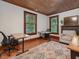 Office space with hardwood floors, two desks, fireplace and natural light at 967 Bynum Rd, Pittsboro, NC 27312
