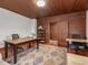 Bright office space with wood floors, a large rug, an adjacent hallway, and natural light at 967 Bynum Rd, Pittsboro, NC 27312