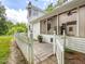 Exterior of home with screened porch and stone pathway at 967 Bynum Rd, Pittsboro, NC 27312