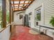 Spacious screened porch with ceiling fan, and tile floor provides an ideal space for outdoor dining and relaxation at 967 Bynum Rd, Pittsboro, NC 27312
