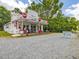 Classic storefront with vintage Coca-Cola signs and music posters at 967 Bynum Rd, Pittsboro, NC 27312