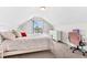 Bright bedroom with white walls, a plush bed, a window for natural light, and a small desk with chair at 1004 Gold Cir, Mebane, NC 27302