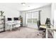 Bright bedroom, ideal for a home office setup with dual desk areas and comfortable seating at 1004 Gold Cir, Mebane, NC 27302