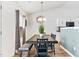 Cozy dining area with a wooden table, complemented by modern lighting and neutral decor at 1004 Gold Cir, Mebane, NC 27302