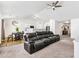 Spacious living room featuring vaulted ceilings and an open floor plan to dining and kitchen at 1004 Gold Cir, Mebane, NC 27302
